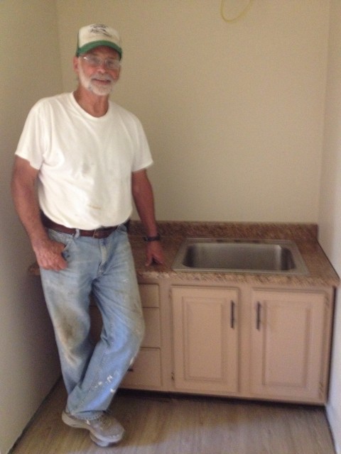 Dick found this cabinet and bought it and the counter top. Then he cut a hole just the right size for the sink. Amazing work for his first time ever doing it!