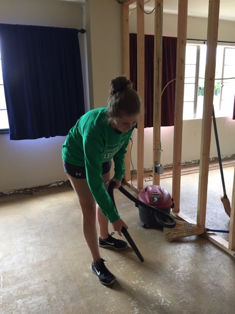 Vacuuming the garbage off the new bedroom floors to prepare for new flooring